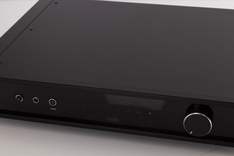 Close up of a used Rega Elex MK4 Integrated Amplifier in a Black finish showing scratches on screen