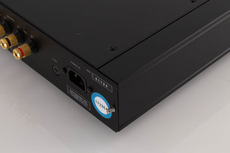 Rear left corner of a used Rega Elex MK4 Integrated Amplifier in a Black finish