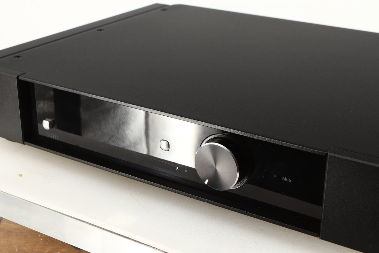 Close up of a used Rega Elex-R Integrated Amplifier in a black finish showing scratches and marks on screen