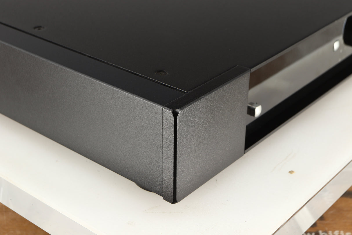 Front left corner of a used Rega Elex-R Integrated Amplifier in a black finish