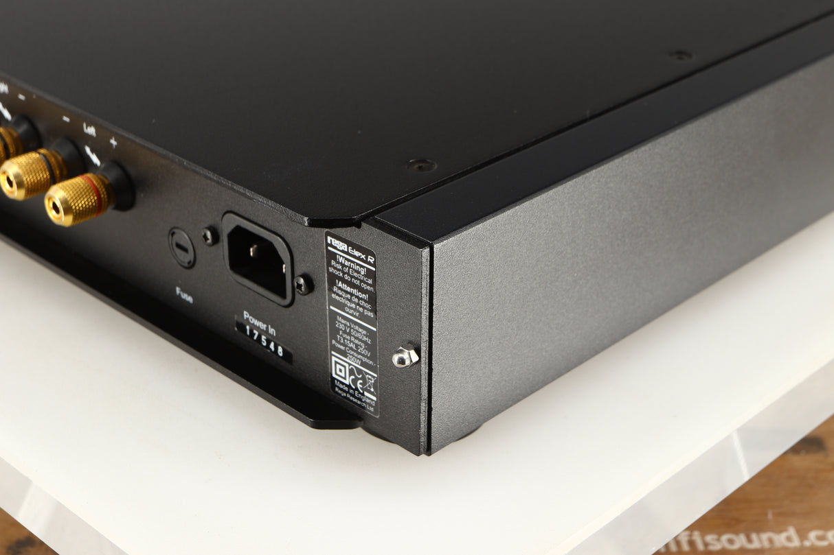 Rear left corner of a used Rega Elex-R Integrated Amplifier in a black finish