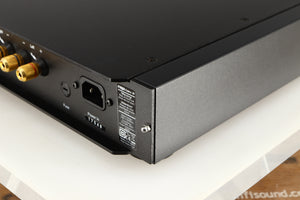 Rear left corner of a used Rega Elex-R Integrated Amplifier in a black finish
