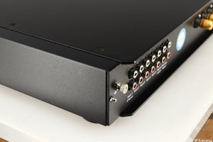 Rear right corner of a used Rega Elex-R Integrated Amplifier in a black finish