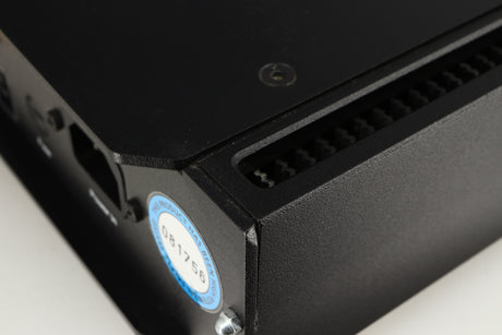 Close up of a used Rega Elicit-R Integrated Amplifier in a black finish showing small chip on rear left corner 