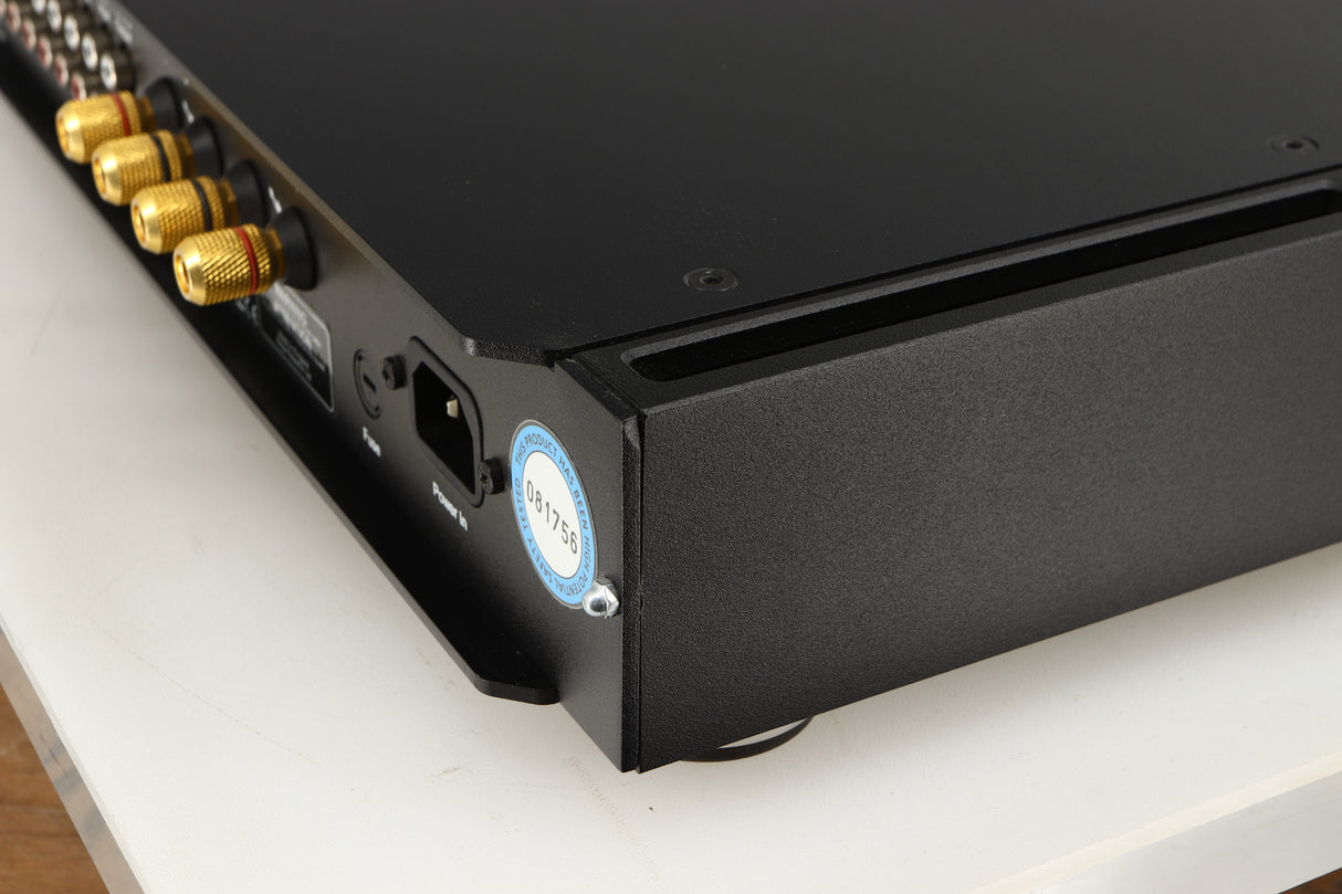 Rear left corner of a used Rega Elicit-R Integrated Amplifier in a black finish