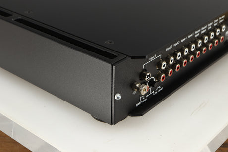 Rear right corner of a used Rega Elicit-R Integrated Amplifier in a black finish