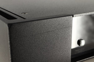 Close up view of a used Rega Elicit-R Integrated Amplifier showing a scratch on the left side of the fascia