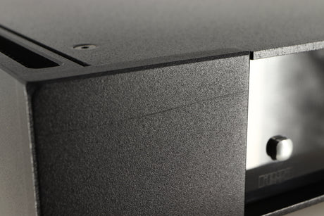 Close up view of a used Rega Elicit-R Integrated Amplifier showing a scratch on the left side of the fascia