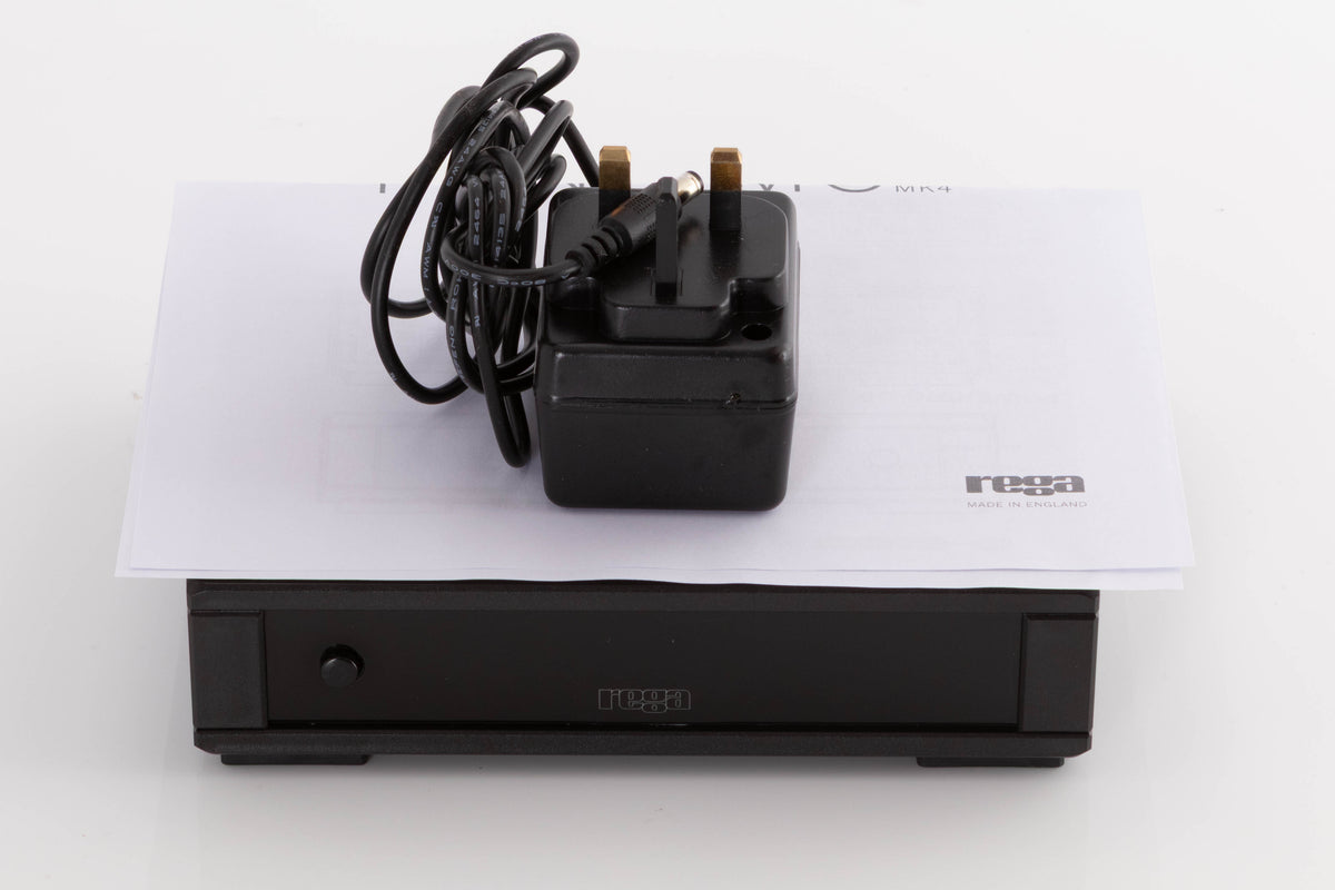 Top of a used Rega FONO MC MK4 Phonostage in a Black finish showing PSU and Manual