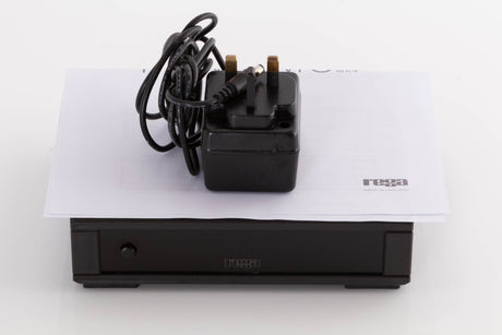 Top of a used Rega FONO MC MK4 Phonostage in a Black finish showing PSU and Manual