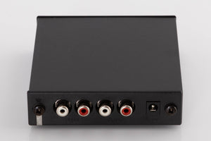 Rear view of a used Rega FONO MINI A2D Phonostage in a Black finish showing Power Input, Phono Inputs and Phono Outputs
