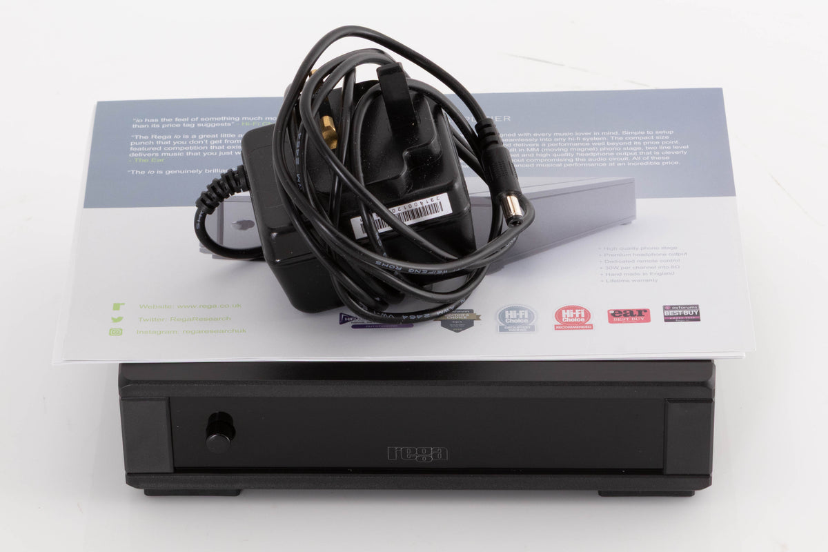Top of a used Rega FONO MM MK5 Phonostage in a Black finish showing Manual and PSU
