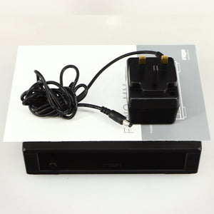 Top of a used Rega FONO MM MK5 Phonostage in a black finish showing Manual and PSU