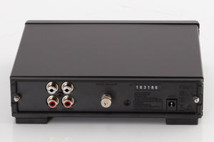 Rear view of a used Rega FONO MM MK5 Phonostage in a Black finish showing Phono Inputs, Phono Outputs and Power Input