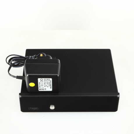 Top of a used Rega FONO MM Phonostage in a black finish showing a power supply