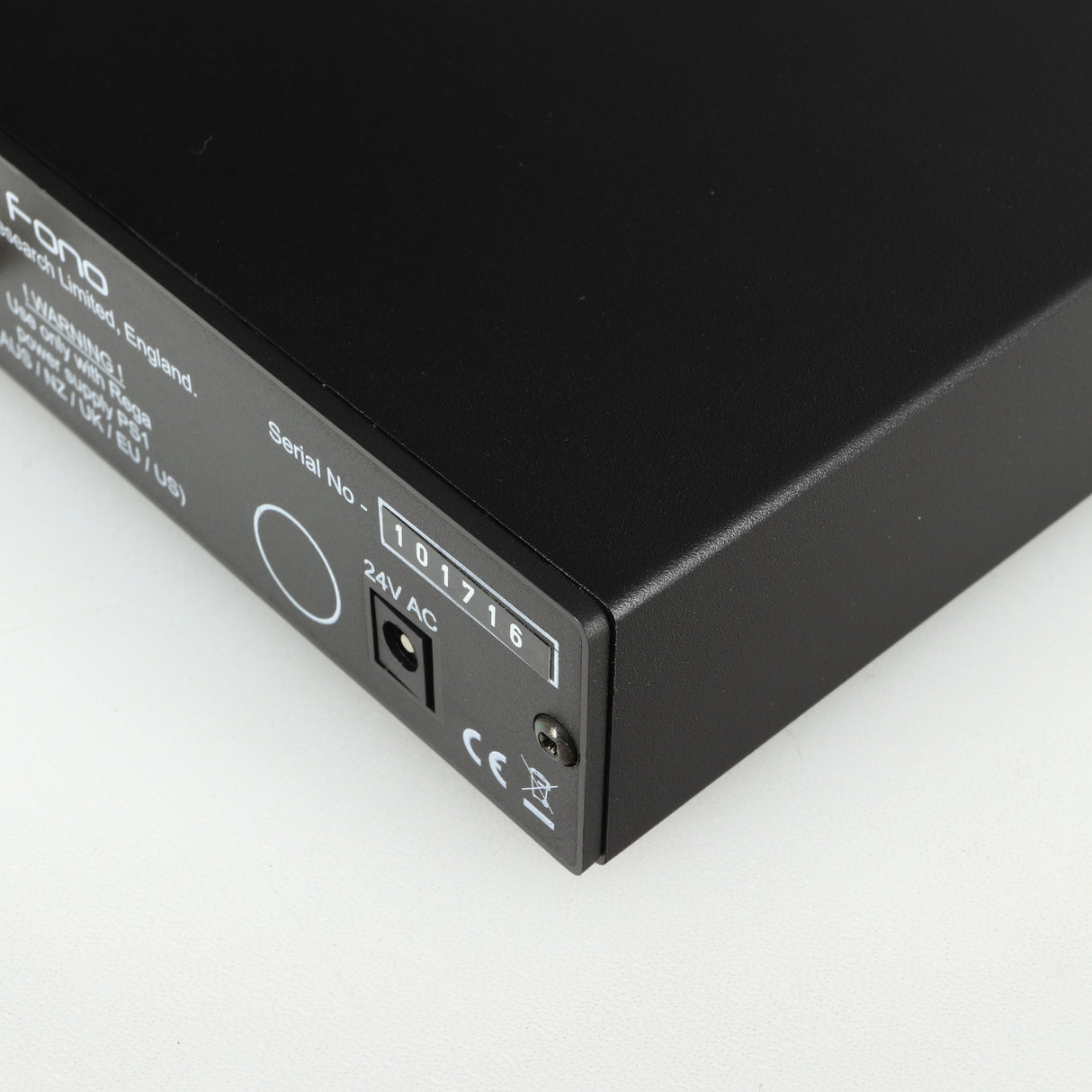 Close up of a used Rega FONO MM Phonostage in a black finish showing the serial number