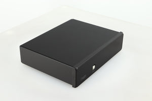 Front left corner of a used Rega FONO MM Phonostage with a black finish