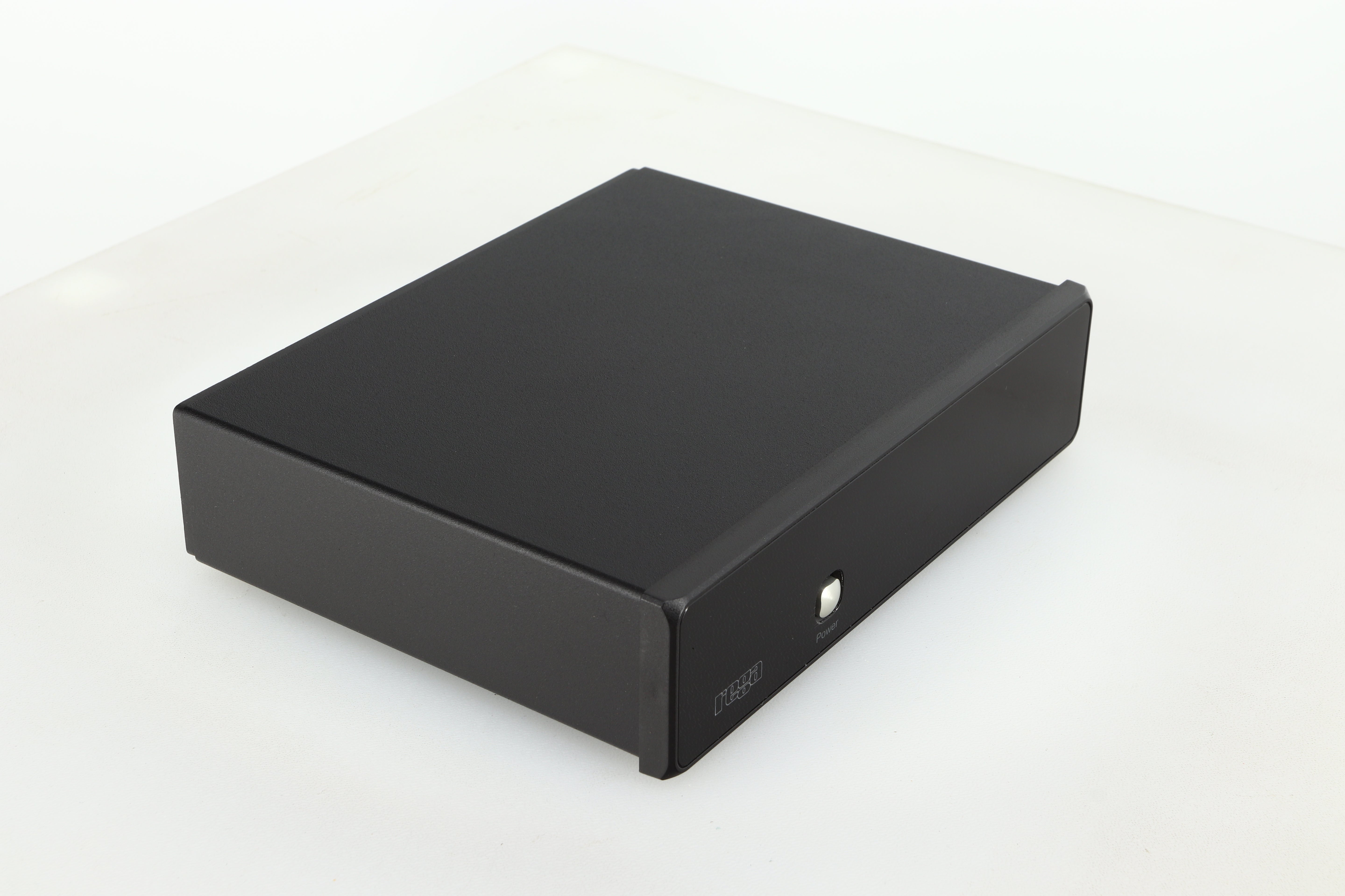 Front left corner of a used Rega FONO MM Phonostage with a black finish