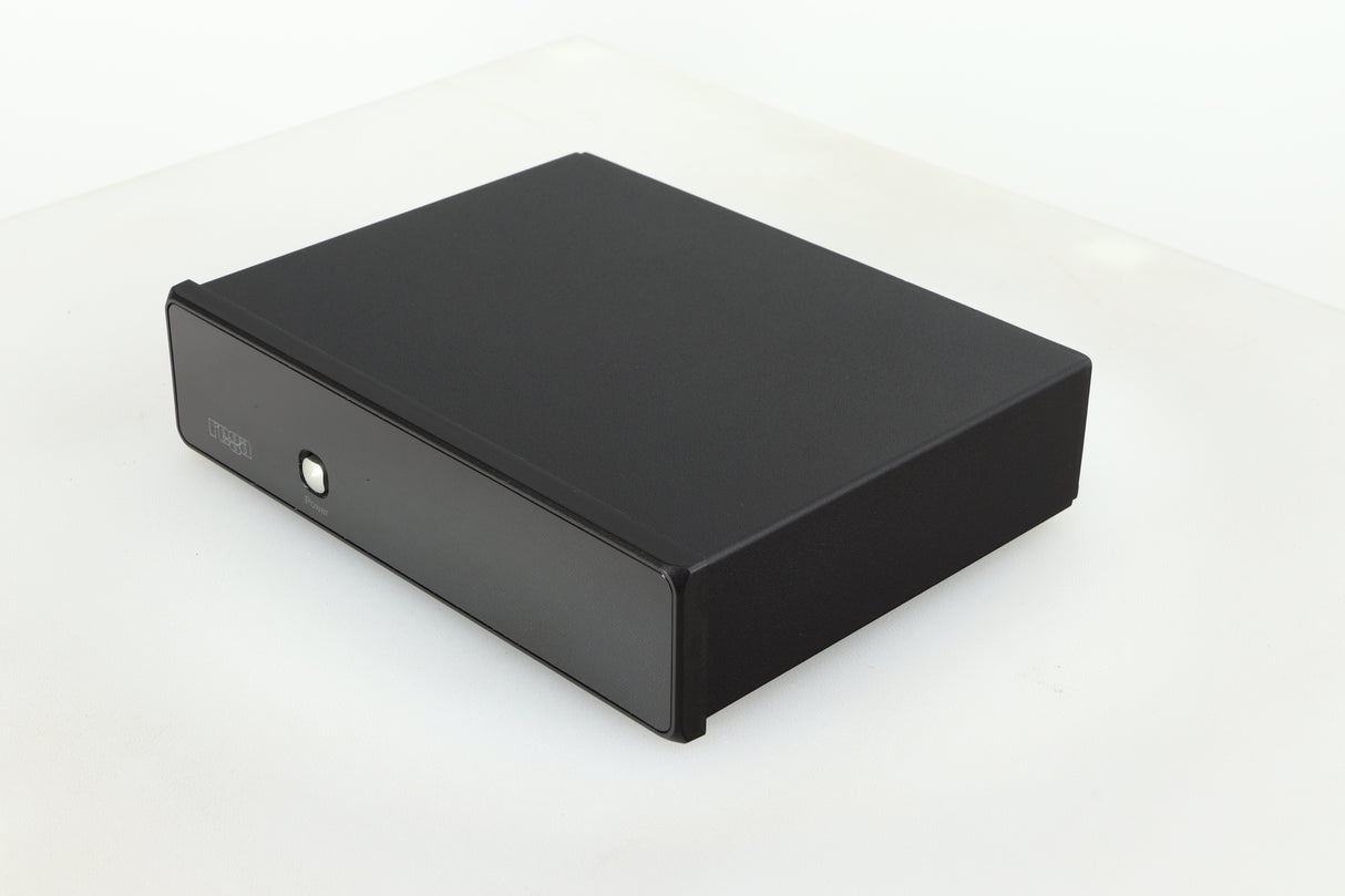 Front right corner of a used Rega FONO MM Phonostage with a black finish