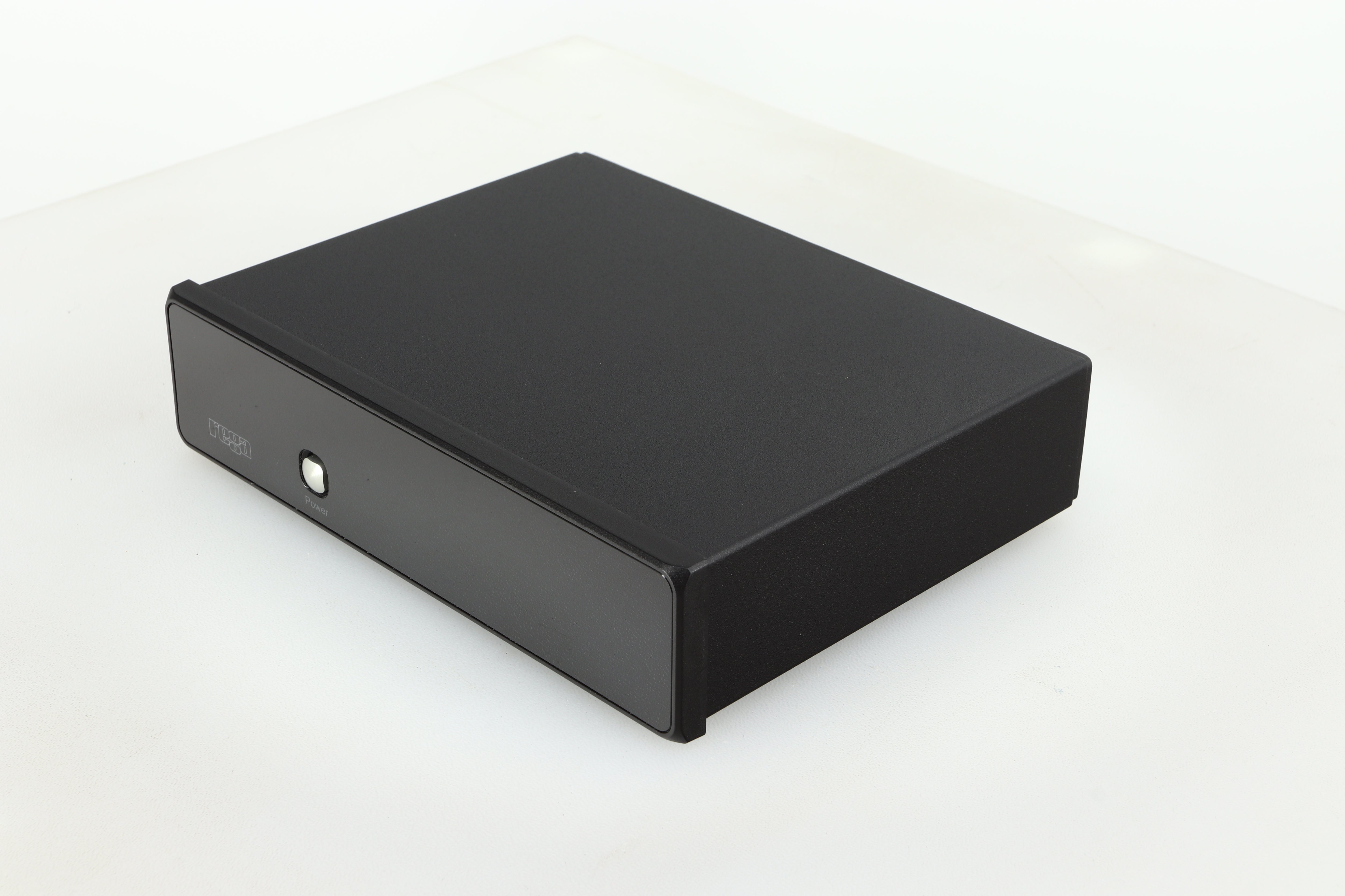 Front right corner of a used Rega FONO MM Phonostage with a black finish