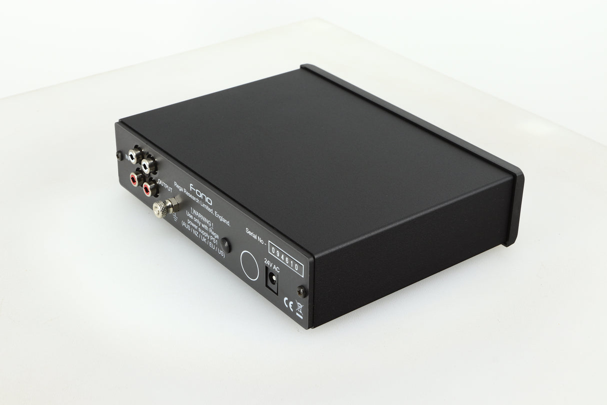 Rear left corner of a used Rega FONO MM Phonostage with a black finish