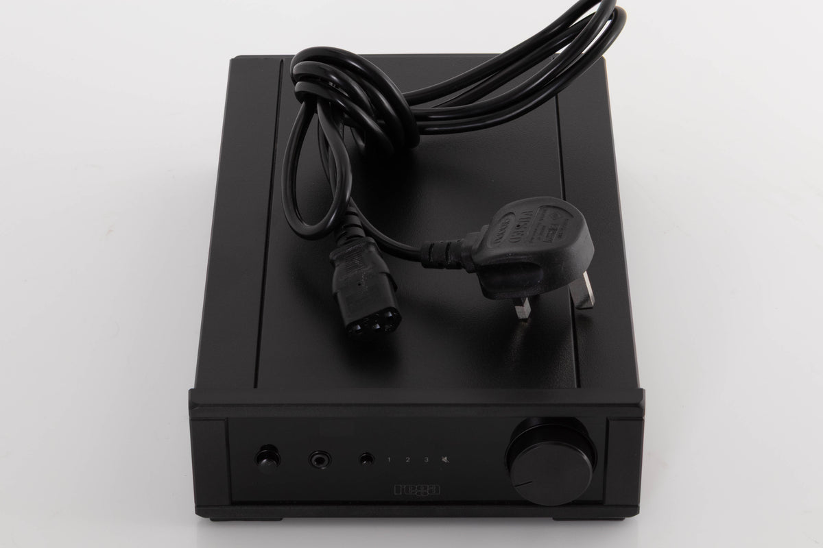 Top of a used Rega IO Integrated Amplifier in a Black finish showing Mains Cable