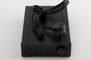 Top of a used Rega IO Integrated Amplifier in a Black finish showing Mains Cable