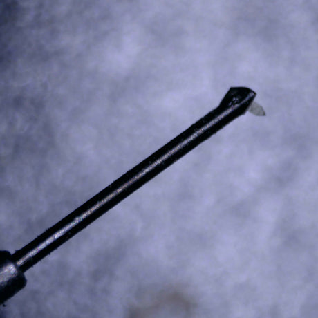 Close up of a used Rega ND9 Moving Magnet Cartridge in a silver finish showing the stylus