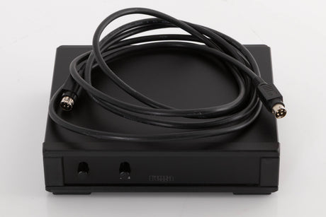 Top of a used Rega NEO Turntable Power Supply in a Black finish showing DIN Cable