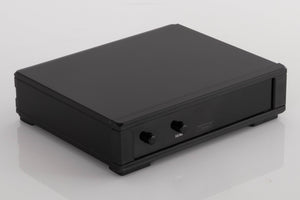 Front left corner of a used Rega NEO Turntable Power Supply in a Black finish