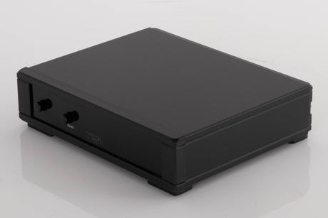 Front right corner of a used Rega NEO Turntable Power Supply in a Black finish