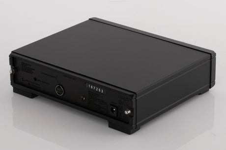 Rear left corner of a used Rega NEO Turntable Power Supply in a Black finish