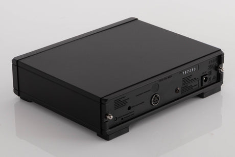 Rear right corner of a used Rega NEO Turntable Power Supply in a Black finish