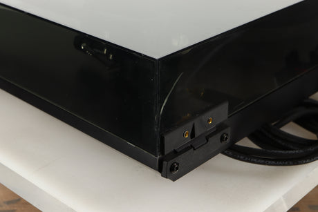 Rear left corner view of a used Rega P3 Turntable in Black finish