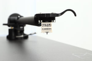 Close up view of a used Rega Planar 1 Plus Turntable in Matt Black showing the cartridge 