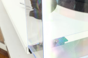 Close up of a used Rega Planar 1 Plus Turntable in a white finish showing some scratching on the lid