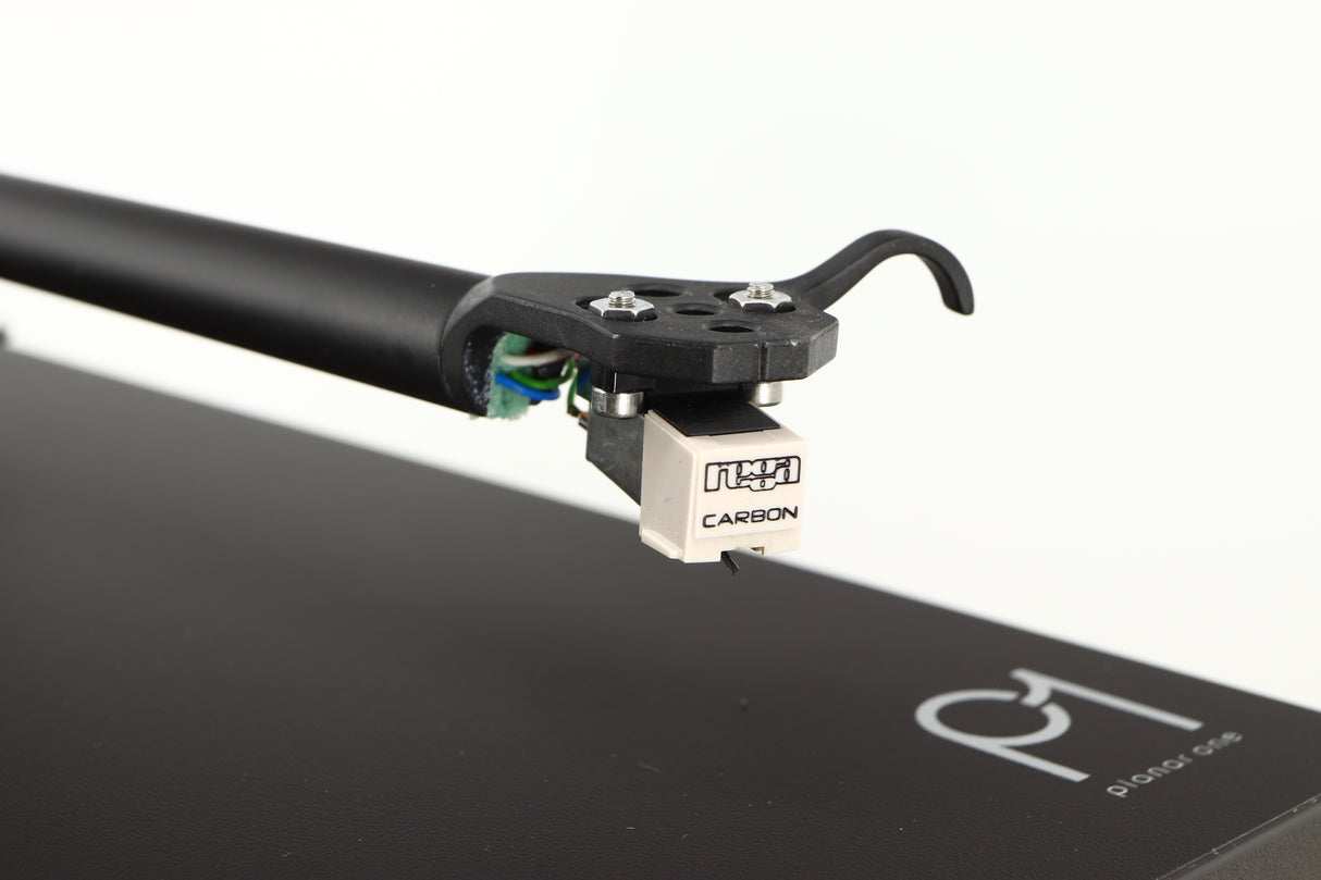 Close up of a used Rega Planar 1 Turntable in a matt black finish showing stylus
