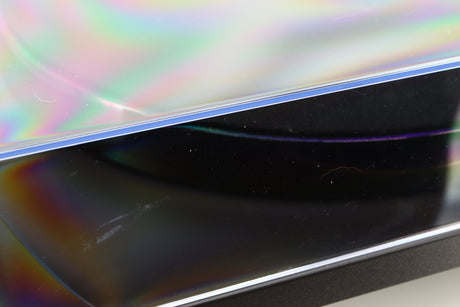 Close up of a used Rega Planar 1 Turntable in a matt black finish showing scratch on lid