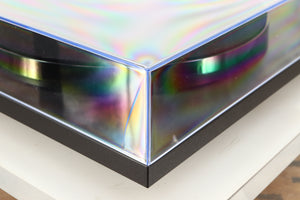 Front left corner of a used Rega Planar 1 Turntable in a matt black finish