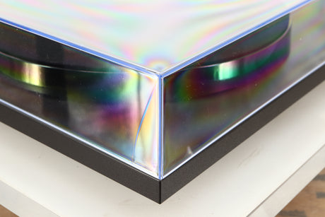 Front left corner of a used Rega Planar 1 Turntable in a matt black finish