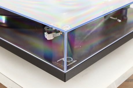 Front right corner of a used Rega Planar 1 Turntable in a matt black finish