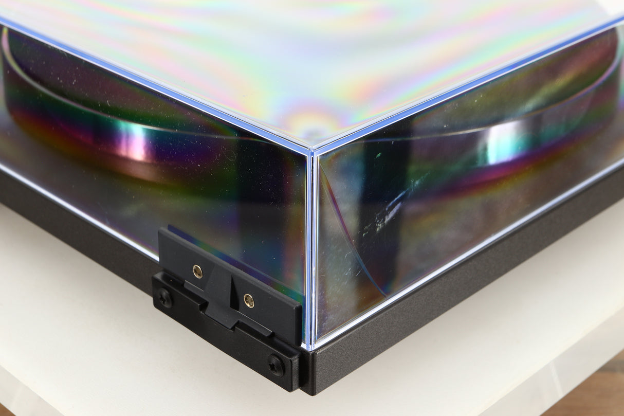 Rear left corner of a used Rega Planar 1 Turntable in a matt black finish