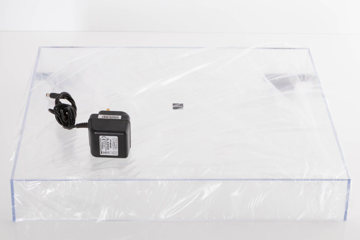 Accessories for a used Rega Planar 1 Turntable in a White finish showing Lid and PSU