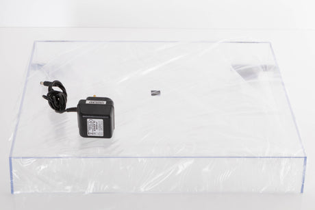 Accessories for a used Rega Planar 1 Turntable in a White finish showing Lid and PSU