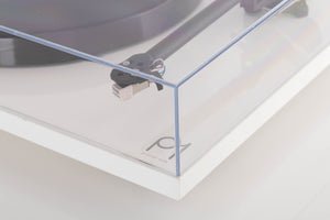 Front right corner of a used Rega Planar 1 Turntable in a White finish
