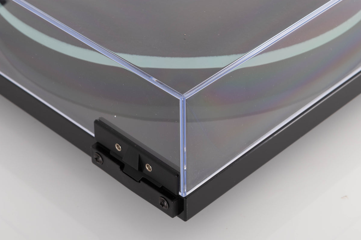 Rear left corner of a used Rega Planar 2 Turntable in a Black finish