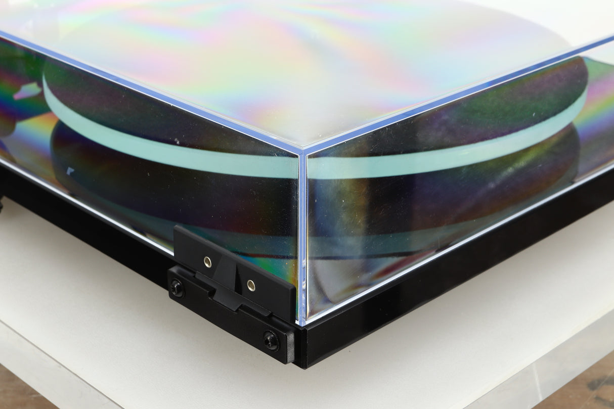 Rear left corner of a used Rega Planar 2 Turntable / AT-VM95E Cartridge in a black finish
