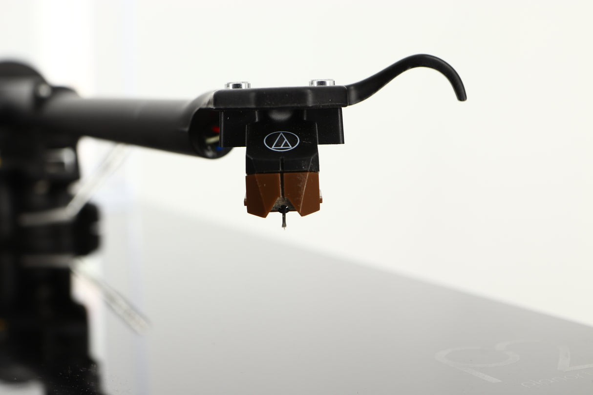 Close up of a used Rega Planar 2 Turntable / AT-VM95SH Cartridge in a black finish showing stylus