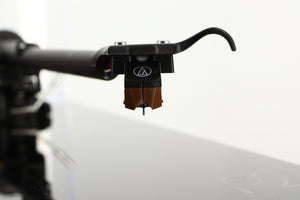 Close up of a used Rega Planar 2 Turntable / AT-VM95SH Cartridge in a black finish showing stylus