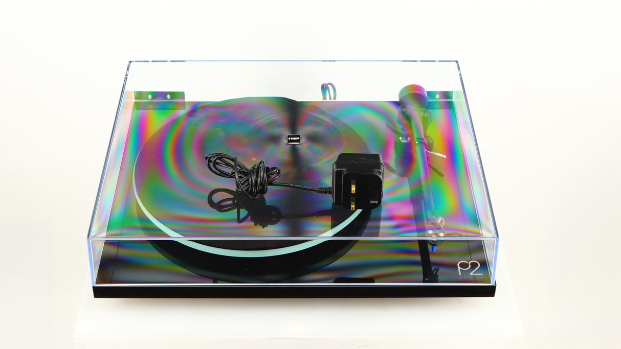 Lid for a used Rega Planar 2 / Elys 2 Cartridge in a black gloss finish showing PSU